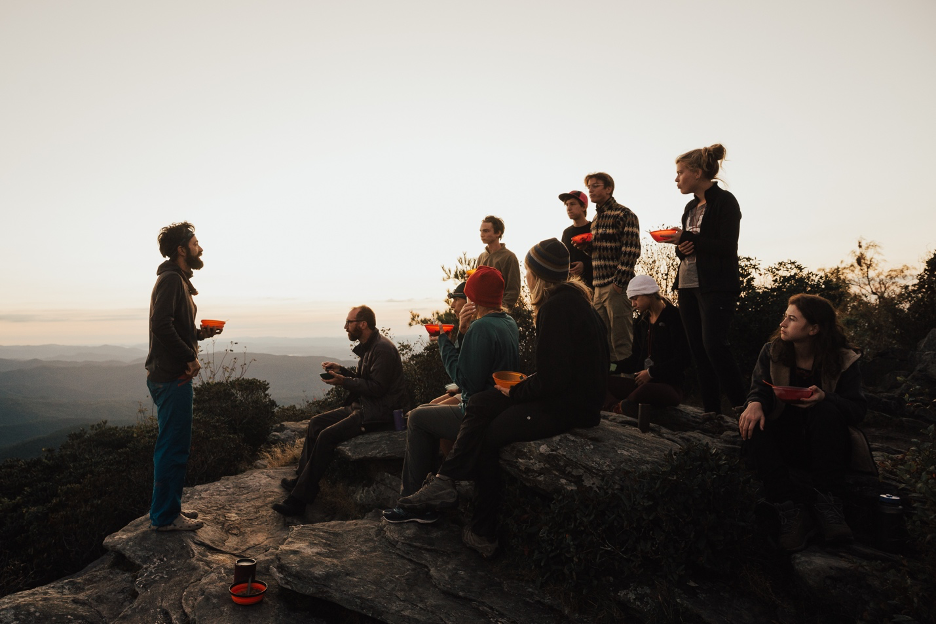 Sharing a meal on an Outward Bound course